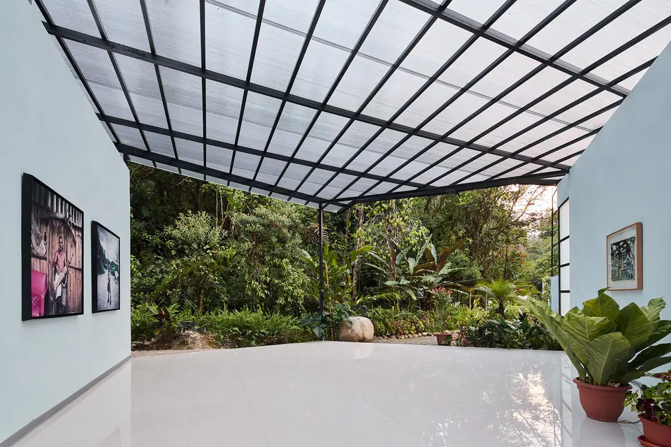 Open-air terrace with contemporary paintings overlooking the garden